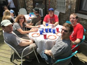 Current residents smile outside their Community Living Option.