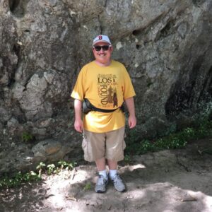 Jonathan standing in front of a rock at Berkshire National Park