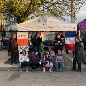 A group of supporters cheer on the Independent Futures' Chicago Marathon runners, known as Team CIF